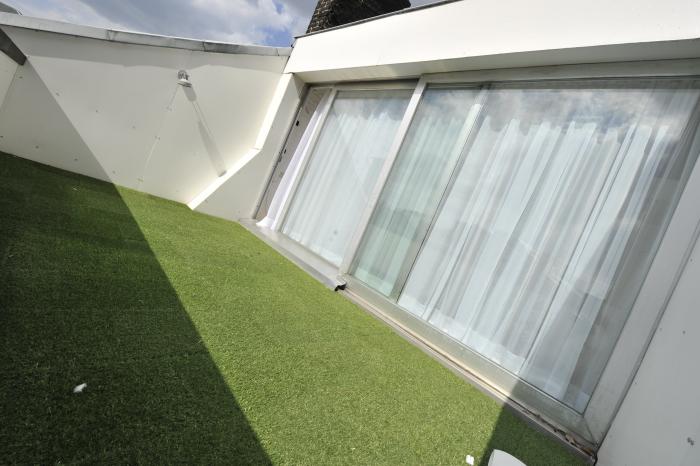 Fabry Penthouse 3ème et 4ème étage -Terrrasse avec porte coulissante du grand Living avec Mezzannine